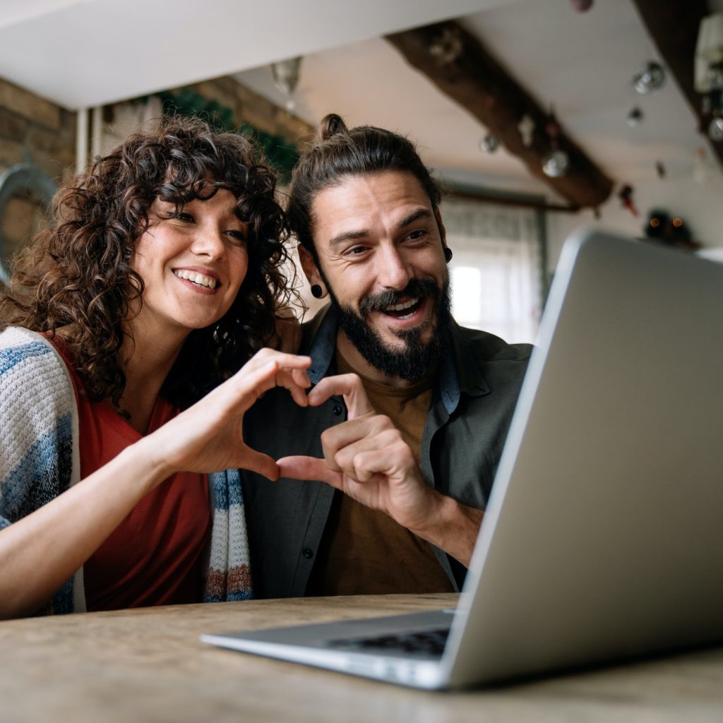 young-smiling-couple-having-online-family-video-call-at-home.jpg